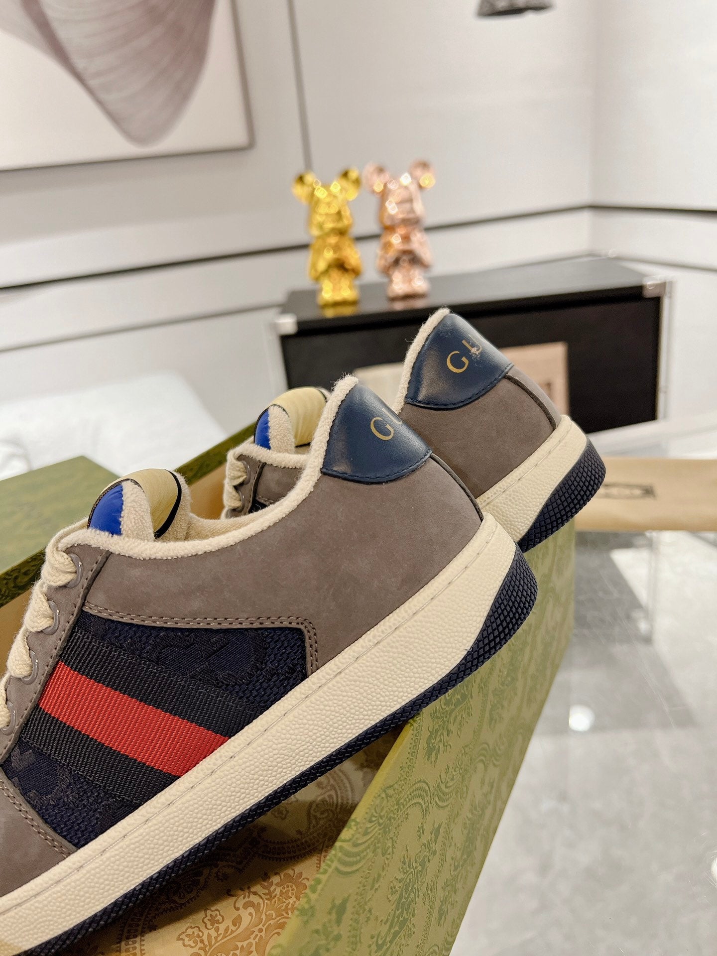 Low-top paneled suede and canvas sneakers in navy and gray.